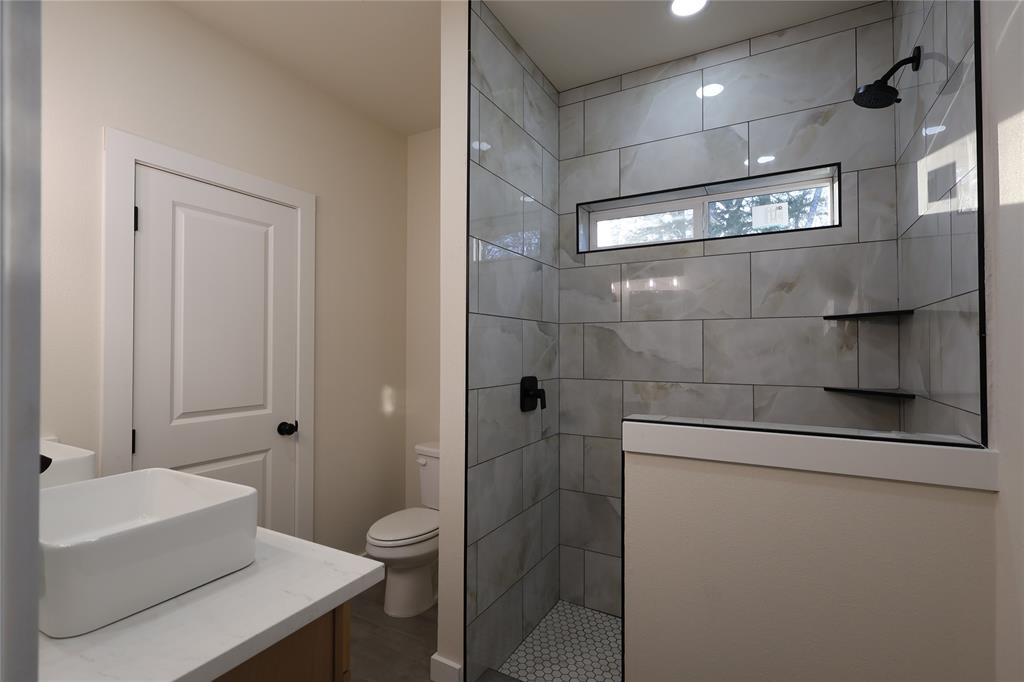 106 Ute Trail Mabank, TX 75156 - Photo 10 of 28 Bathroom with walk in shower and vanity