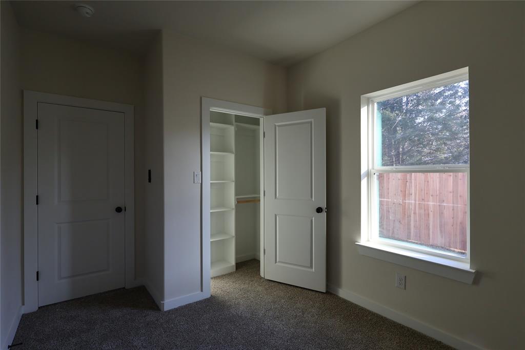 106 Ute Trail Mabank, TX 75156 - Photo 14 of 28 Unfurnished bedroom with carpet flooring and a closet