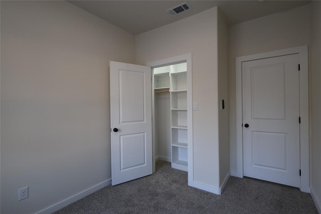 106 Ute Trail Mabank, TX 75156 - Photo 15 of 28 Unfurnished bedroom featuring carpet flooring and a closet