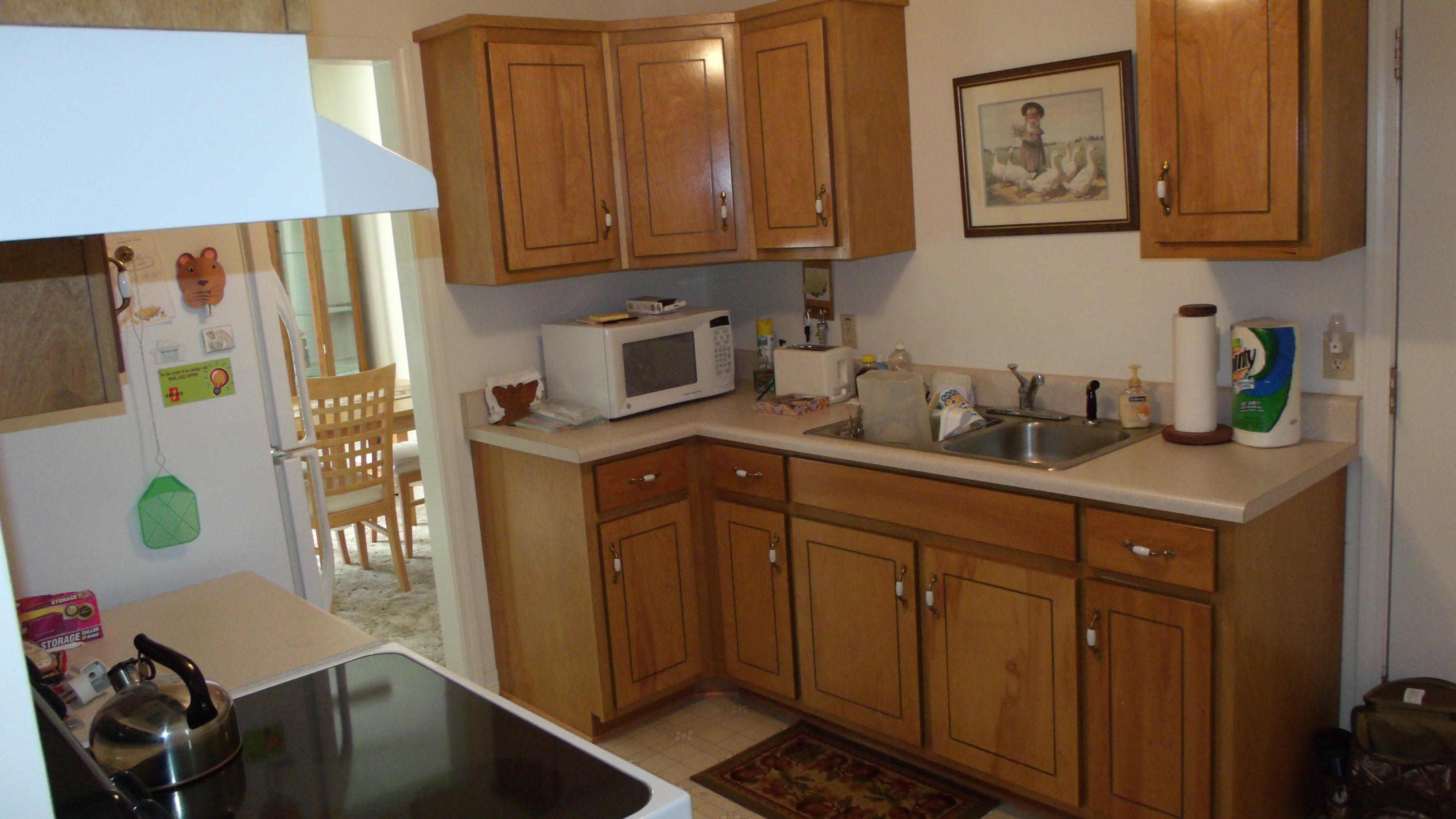 5918 Jack Stokes Road Baker, FL 32531 - Photo 11 of 23 a kitchen with a sink cabinets and appliances