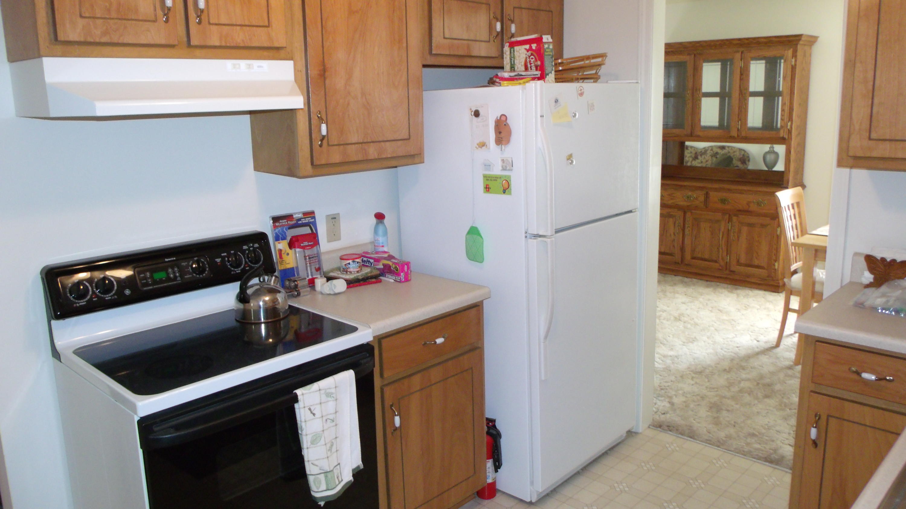 5918 Jack Stokes Road Baker, FL 32531 - Photo 12 of 23 a kitchen with a refrigerator and a stove