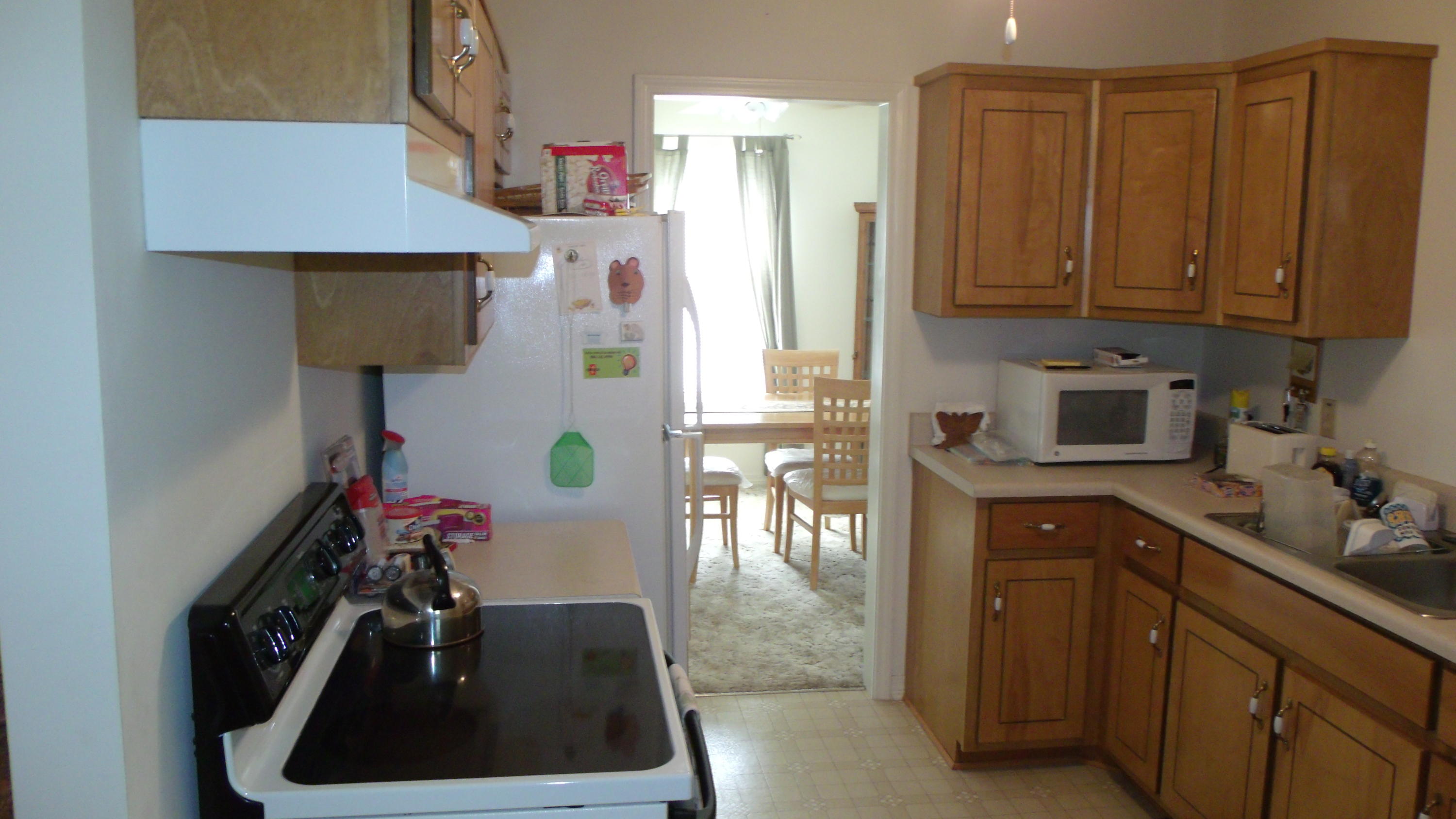 5918 Jack Stokes Road Baker, FL 32531 - Photo 13 of 23 a kitchen with a sink and cabinets