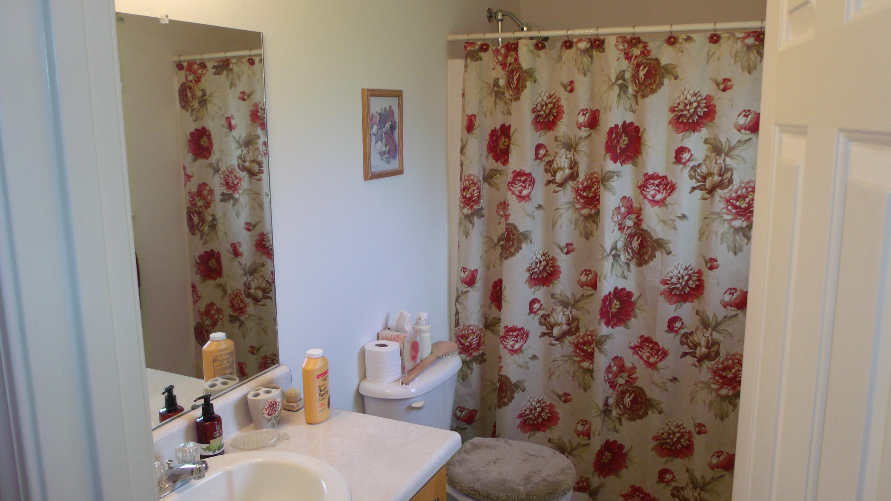 5918 Jack Stokes Road Baker, FL 32531 - Photo 18 of 23 a living room with a shower curtain