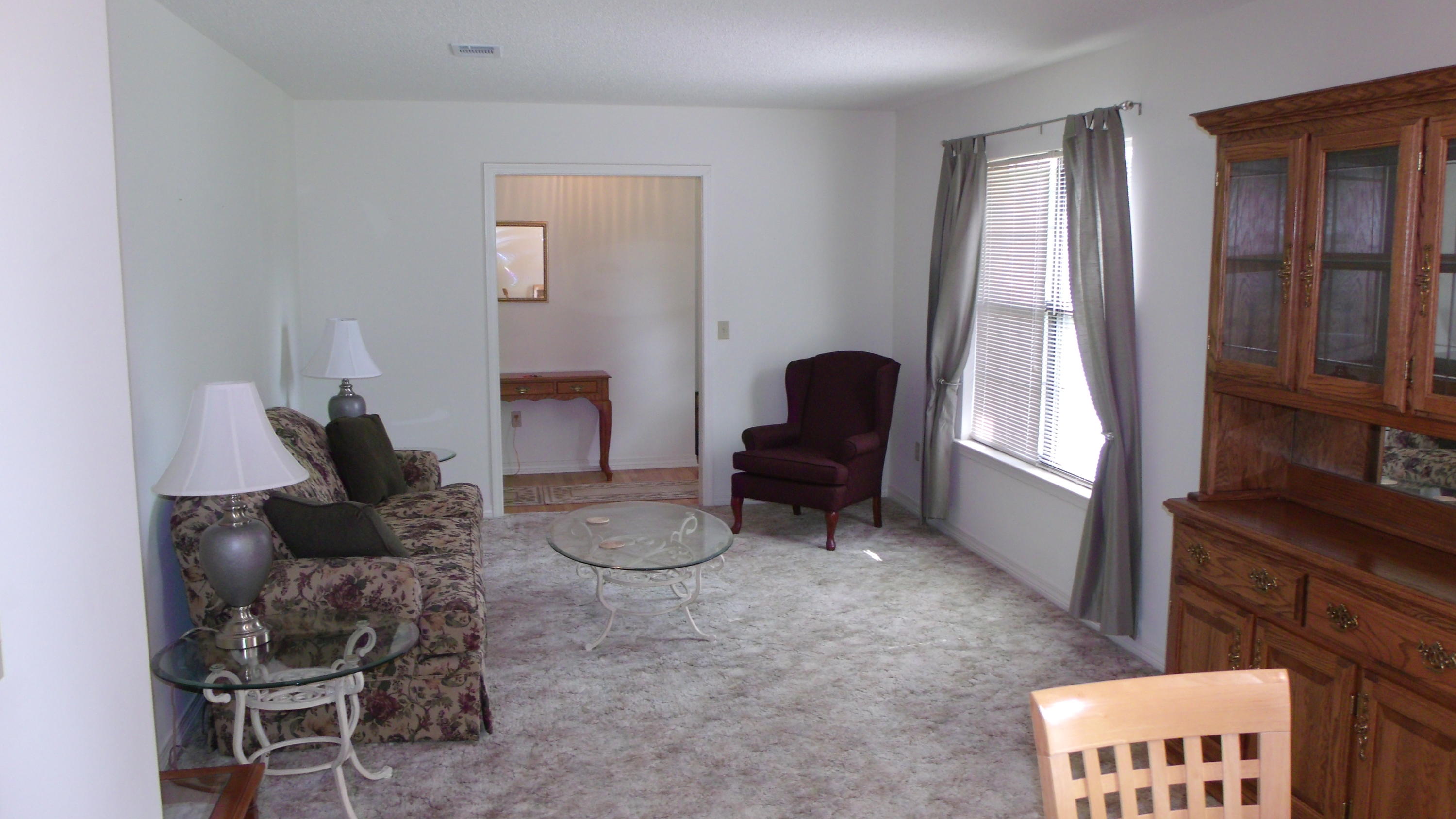 5918 Jack Stokes Road Baker, FL 32531 - Photo 10 of 23 a living room with furniture and a window