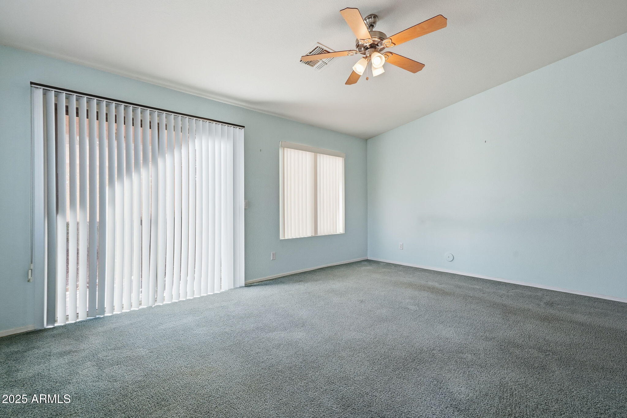 2101 South Meridian Road, Unit 354 Apache Junction, AZ 85120 - Photo 15 of 50 an empty room with windows and fan