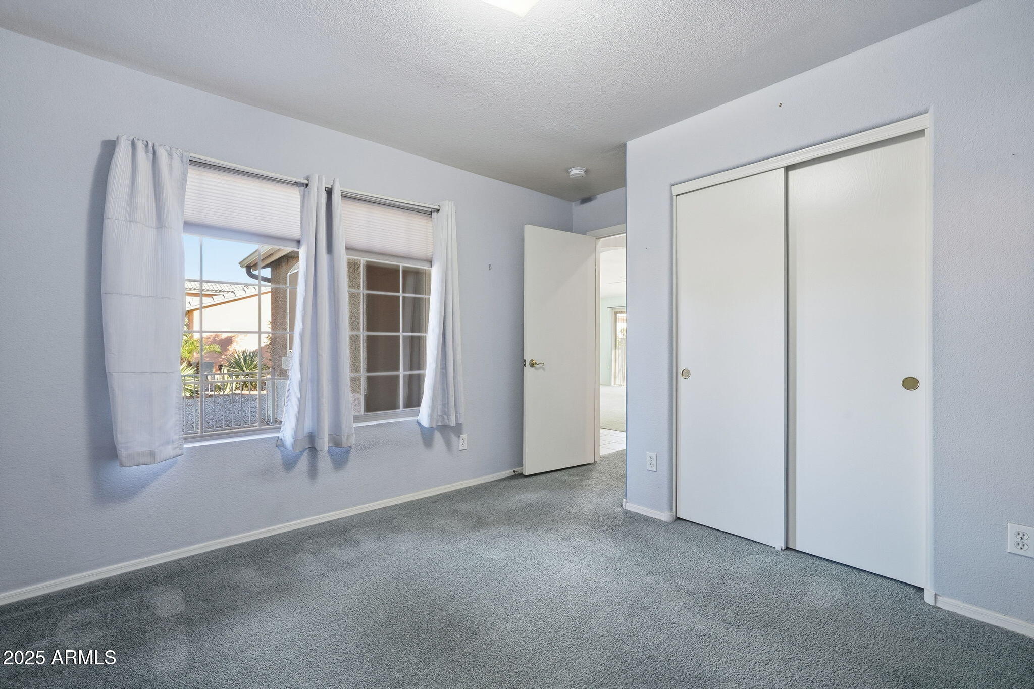 2101 South Meridian Road, Unit 354 Apache Junction, AZ 85120 - Photo 17 of 50 an empty room with windows