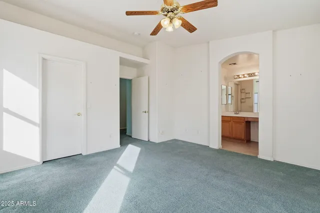 a view of a hallway to a bedroom with a bedroom