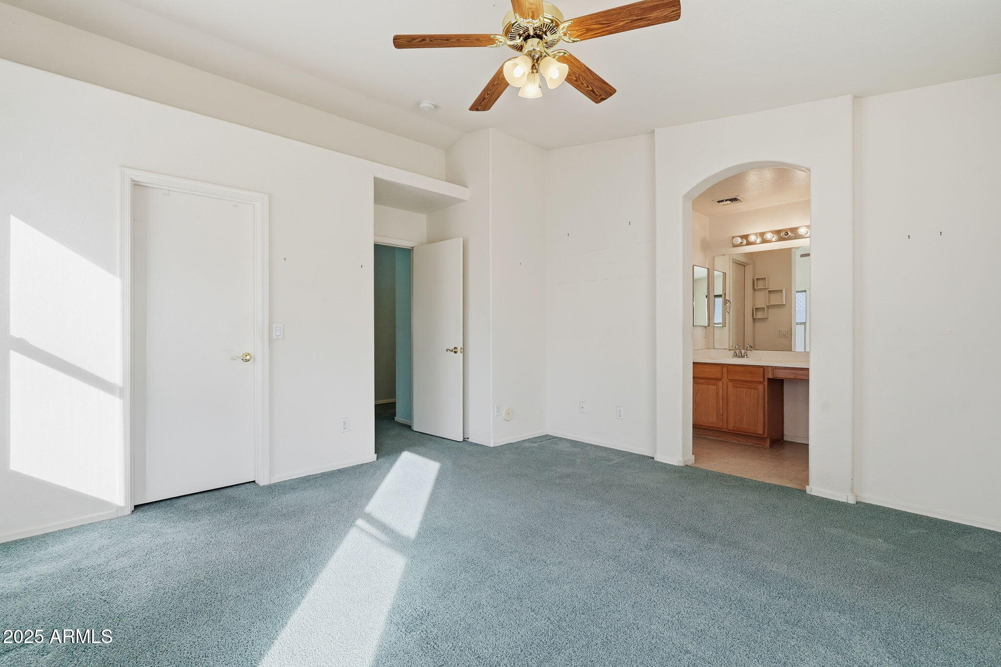 2101 South Meridian Road, Unit 354 Apache Junction, AZ 85120 - Photo 20 of 50 a view of a hallway to a bedroom with a bedroom