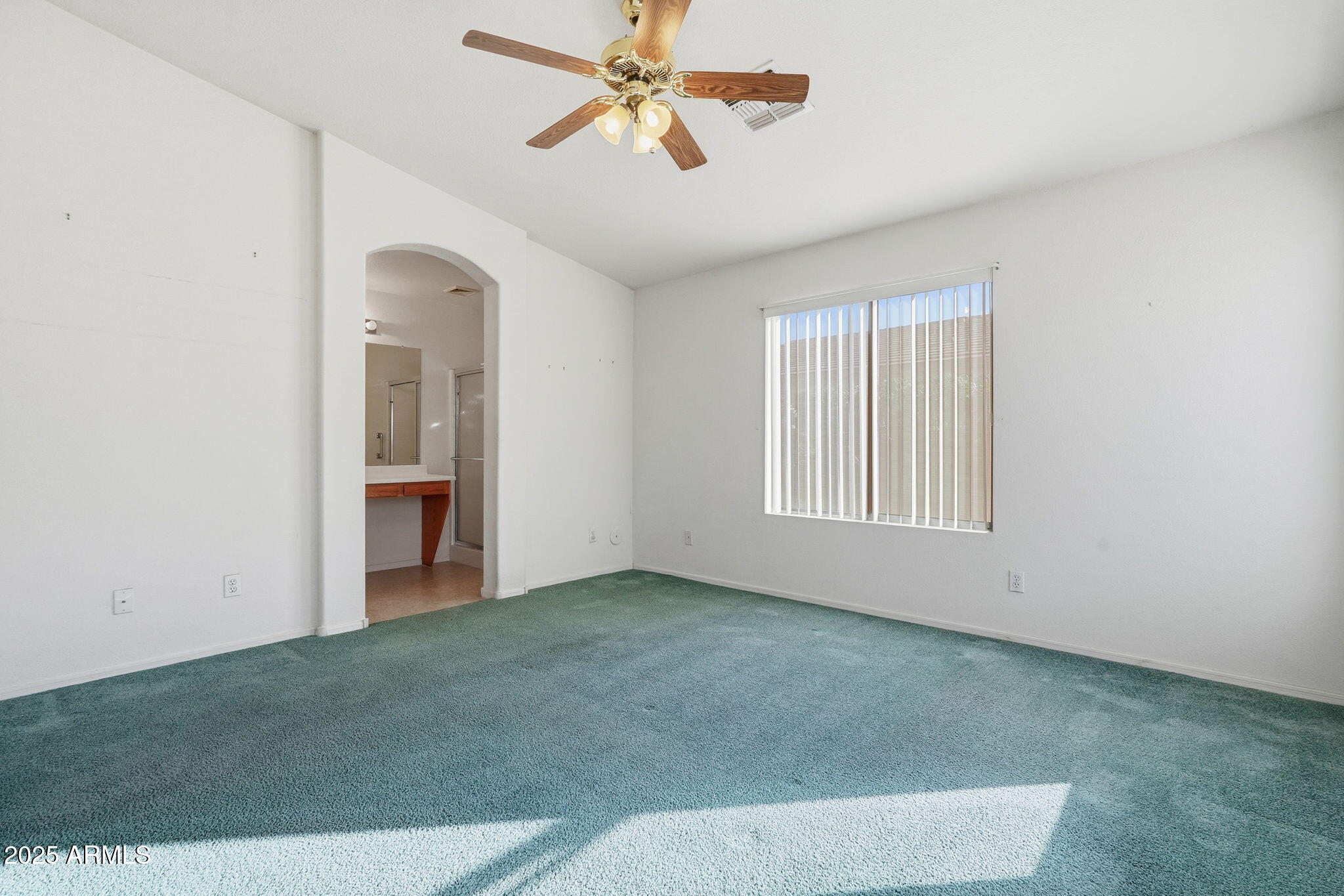 2101 South Meridian Road, Unit 354 Apache Junction, AZ 85120 - Photo 21 of 50 an empty room with windows and fan