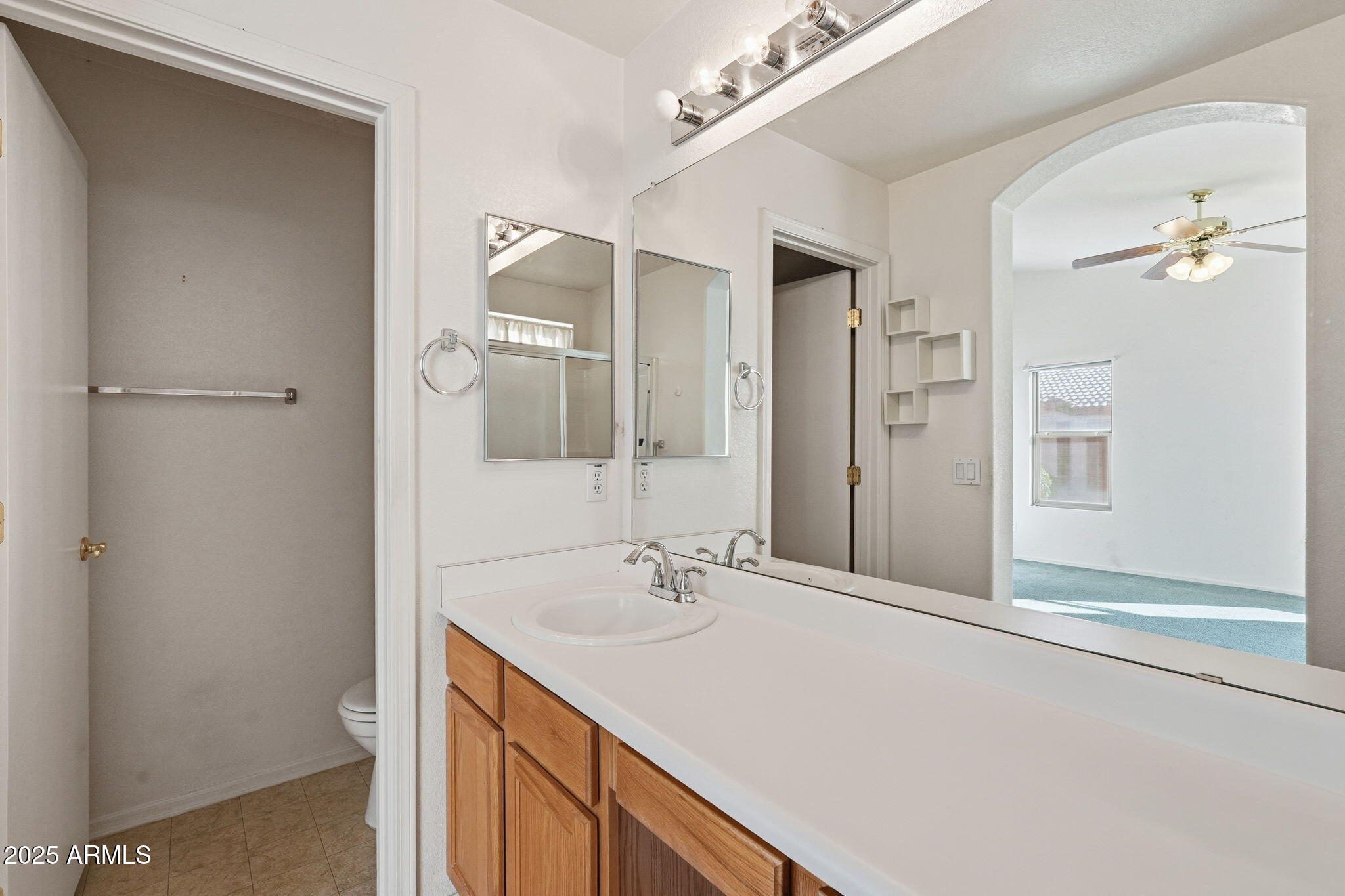 2101 South Meridian Road, Unit 354 Apache Junction, AZ 85120 - Photo 28 of 50 a bathroom with a sink double vanity and a mirror