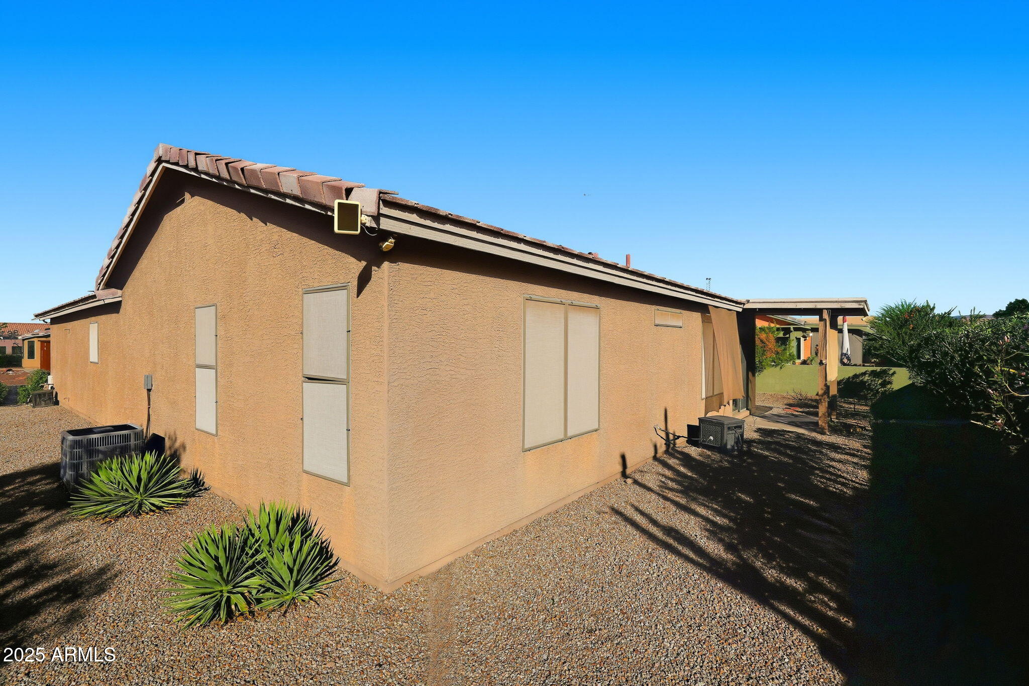 2101 South Meridian Road, Unit 354 Apache Junction, AZ 85120 - Photo 35 of 50 a backyard of a house with seating space