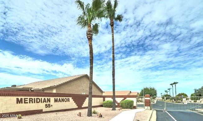 2101 South Meridian Road, Unit 354 Apache Junction, AZ 85120 - Photo 37 of 50 a view of a street with a building in the background