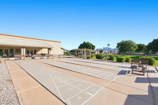 a childrens park with lots of swings and slides