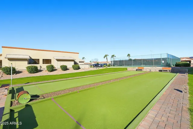 a view of swimming pool with a yard