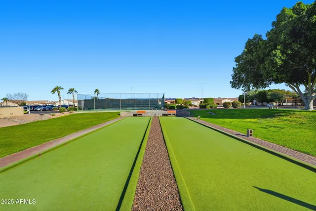 a view of a swimming pool with a yard