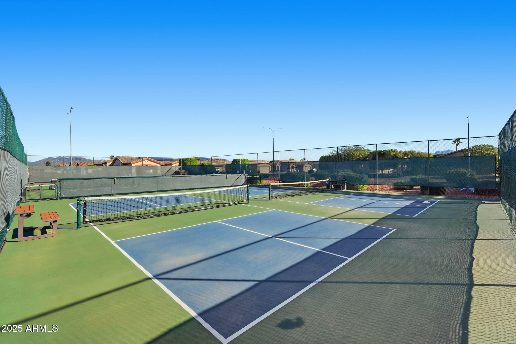 2101 South Meridian Road, Unit 354 Apache Junction, AZ 85120 - Photo 44 of 50 a view of a tennis ground with large trees