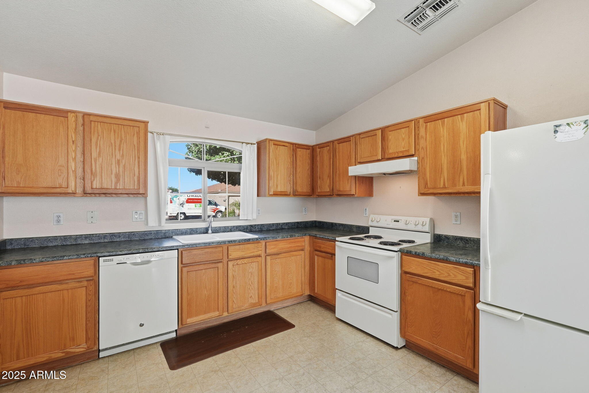 2101 South Meridian Road, Unit 354 Apache Junction, AZ 85120 - Photo 10 of 50 a kitchen with white cabinets sink and stove