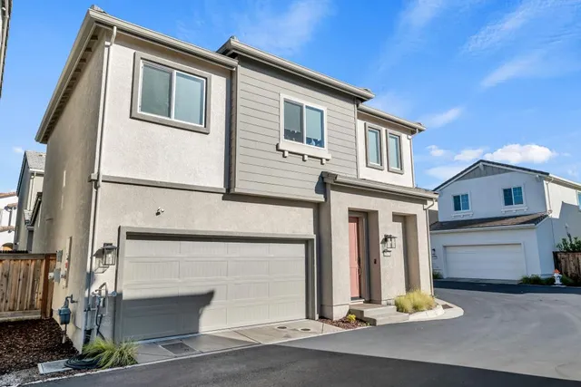a front view of a house with a garage
