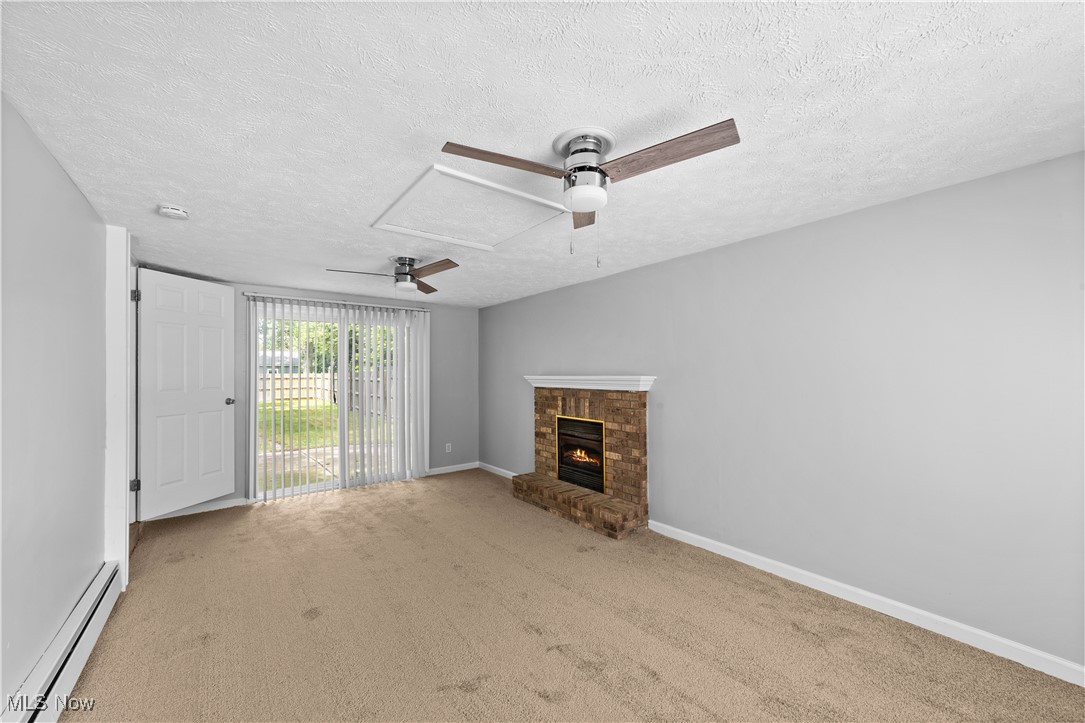 4920 Marigold Road Mentor, OH 44060 - Photo 7 of 34 Living Room with new carpeting and freshly painted interior and stylish ceiling fan