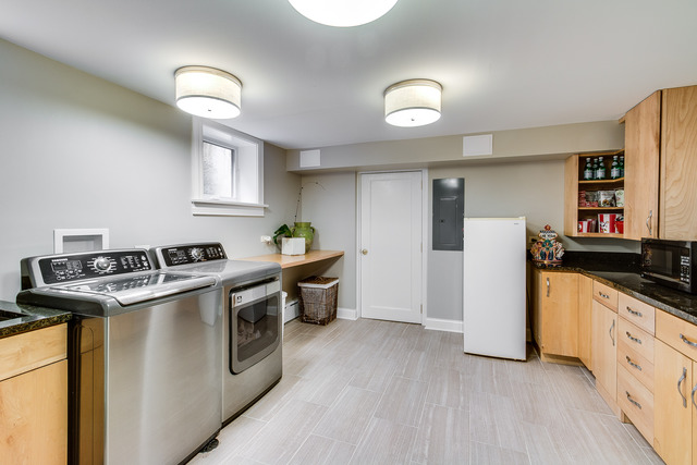 1005 Sheridan Road Evanston, IL 60202 - Photo 23 of 25 a kitchen with stainless steel appliances granite countertop a stove and a sink