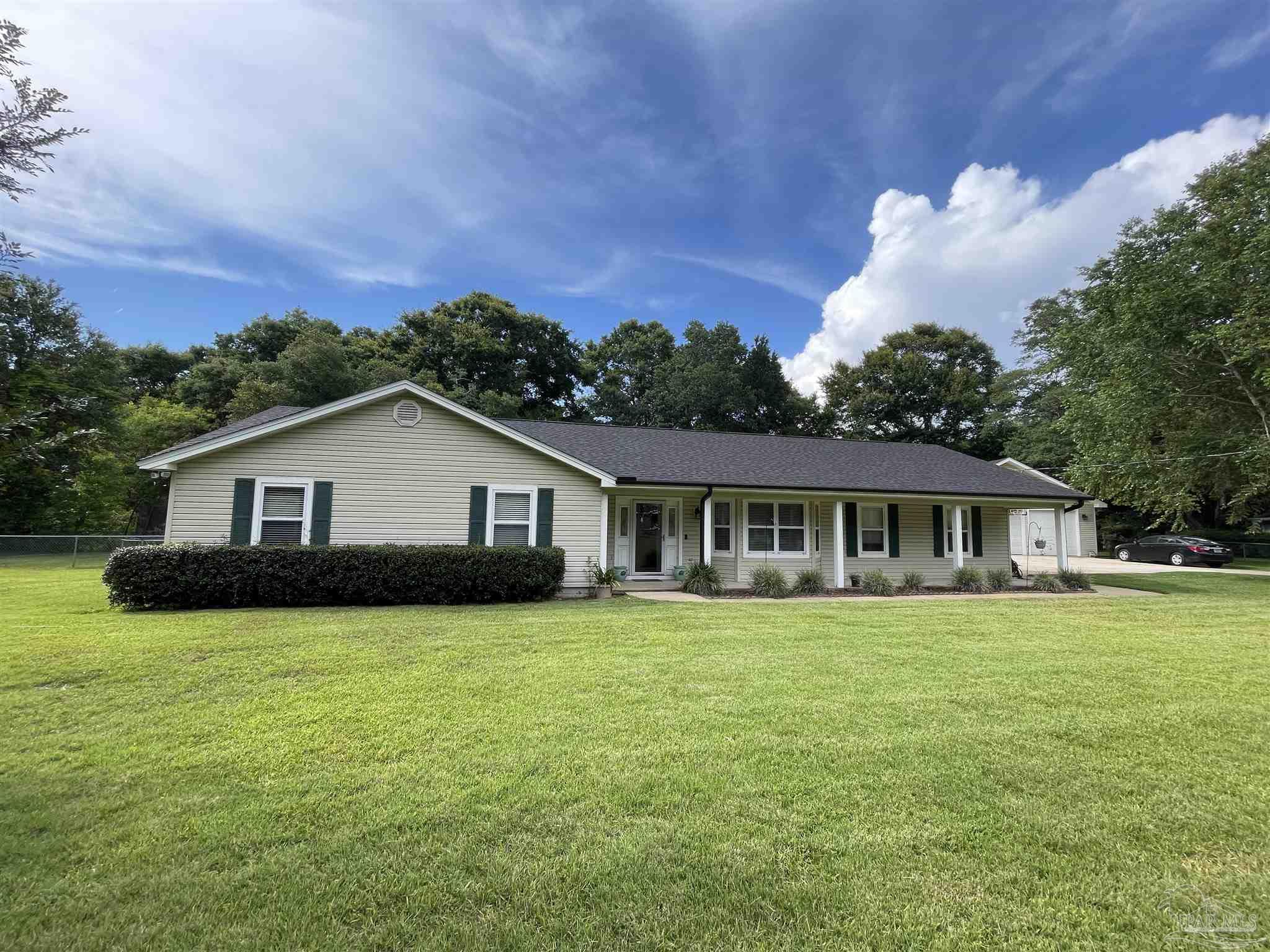 3143 Aarons Way Pace, FL 32571 - Photo 1 of 38 a view of a house with a big yard