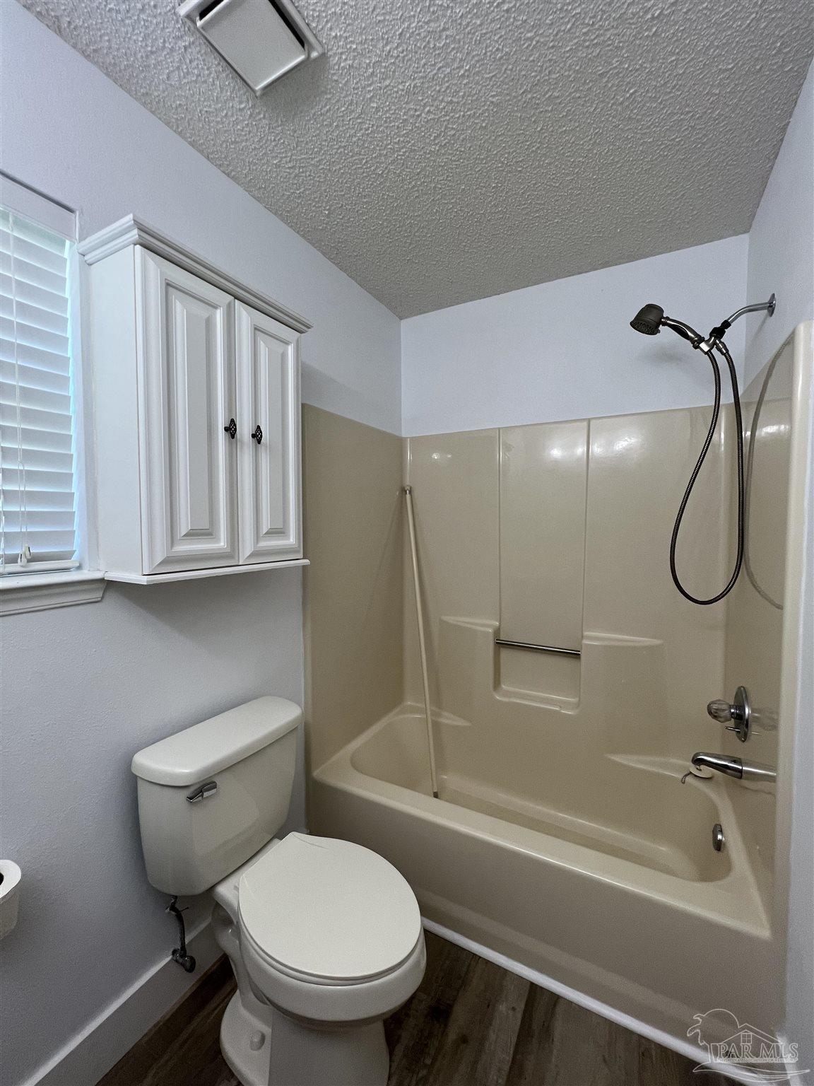 3143 Aarons Way Pace, FL 32571 - Photo 25 of 38 a bathroom with a toilet bathtub and shower