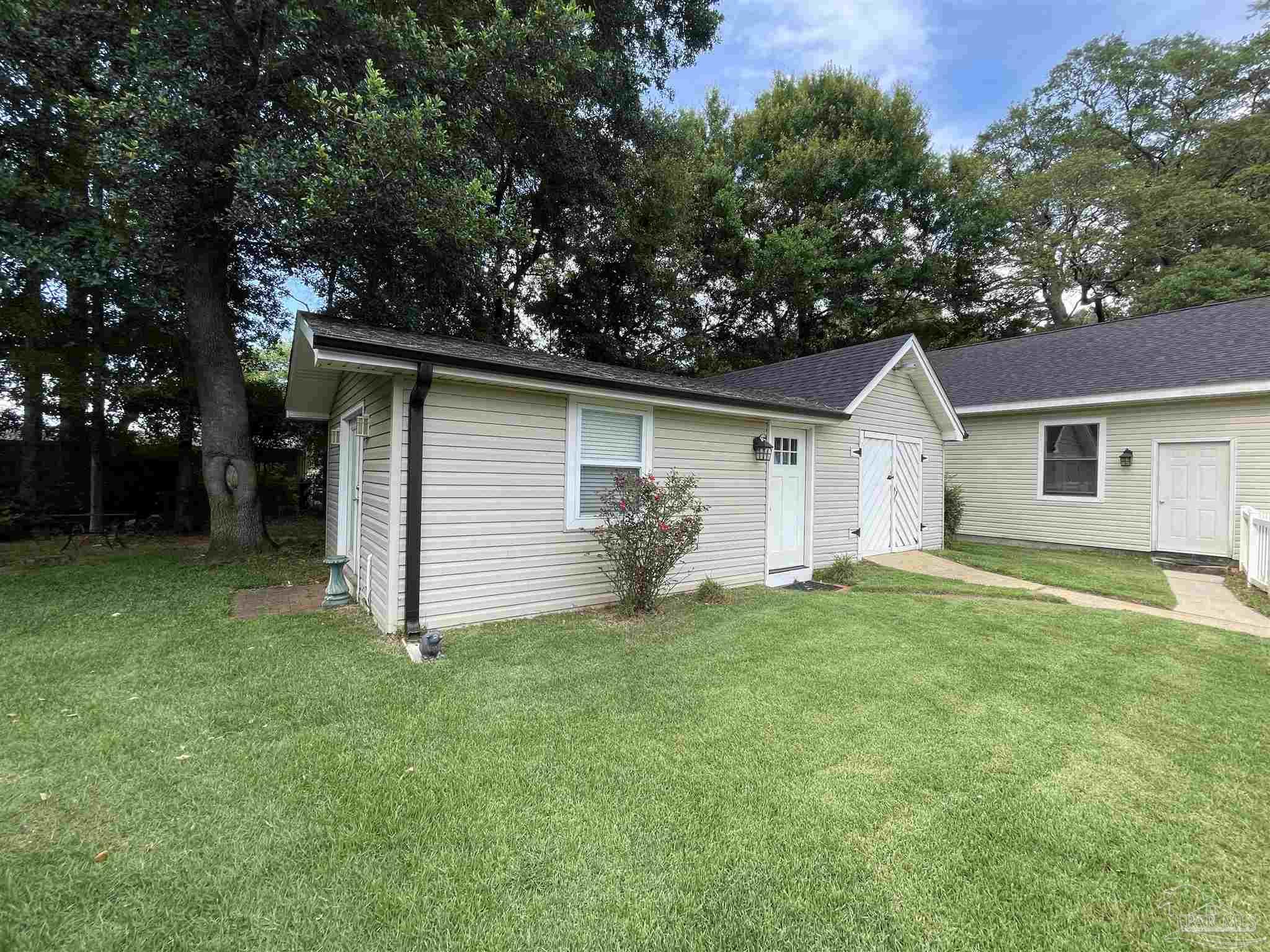 3143 Aarons Way Pace, FL 32571 - Photo 38 of 38 a view of a house with a backyard
