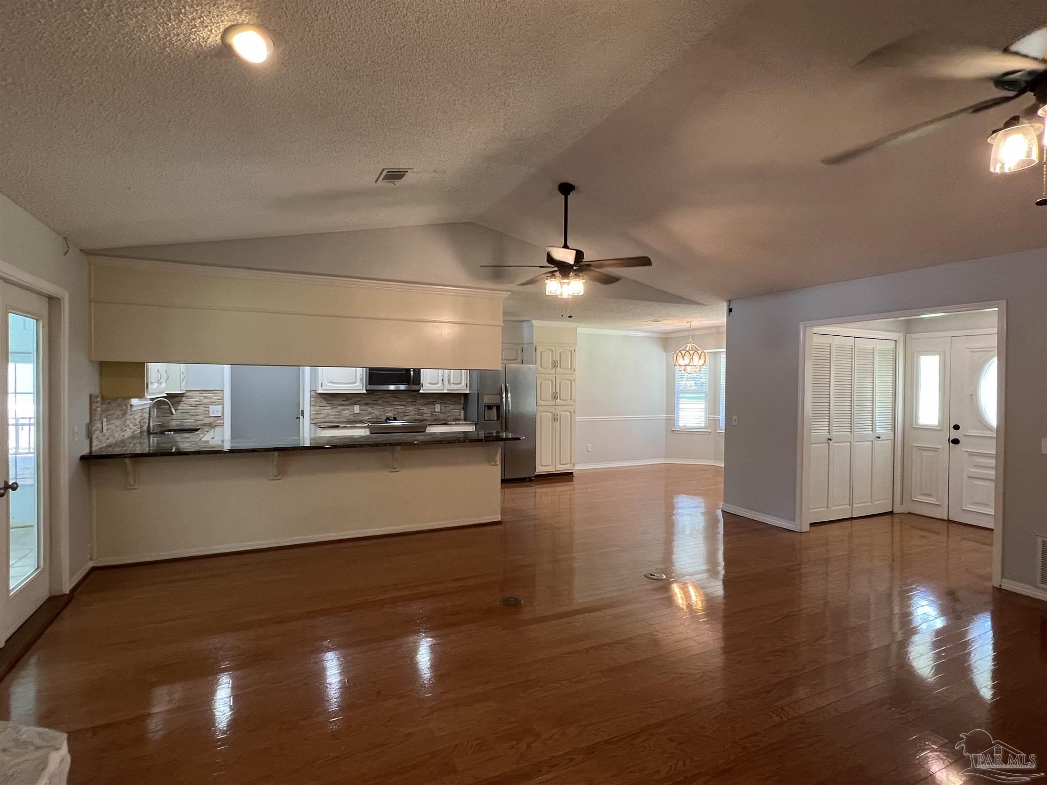 3143 Aarons Way Pace, FL 32571 - Photo 9 of 38 a view of a electric appliances in a room