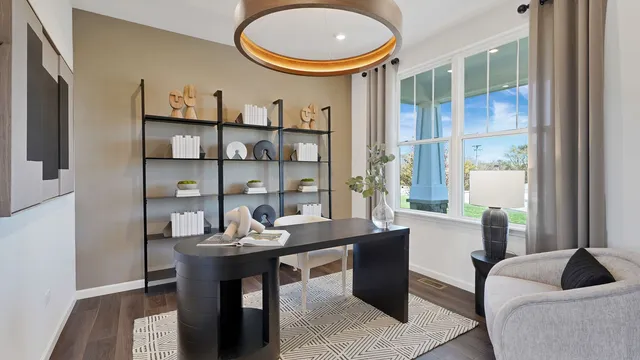 a living room with furniture a rug and a large window