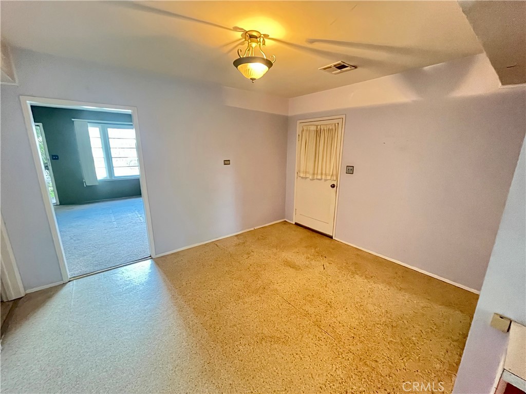 4245-4245 Homewood Court Riverside, CA 92506 - Photo 13 of 15 an empty room with windows and entrance
