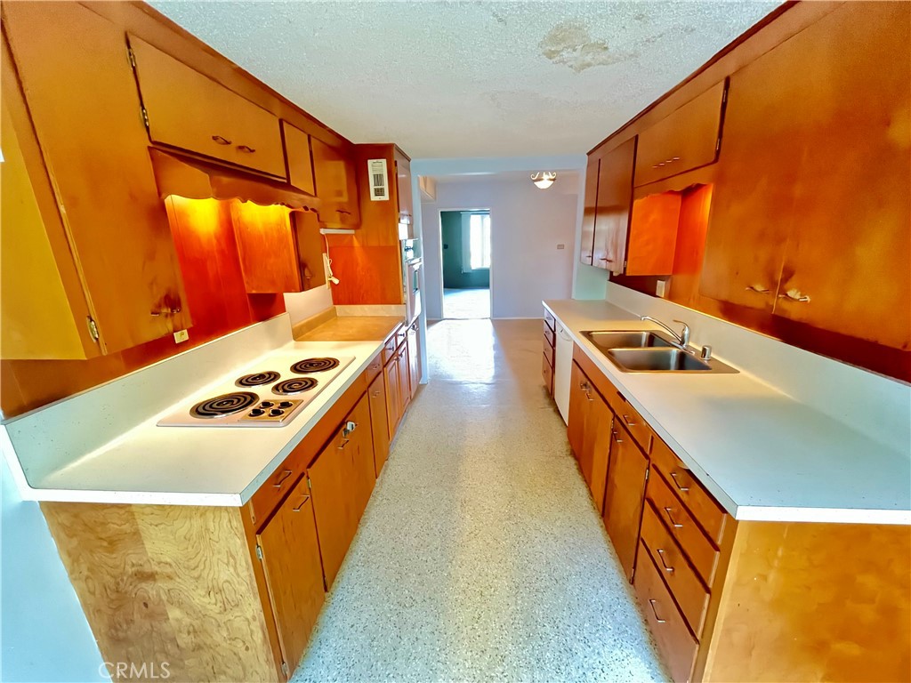 4245-4245 Homewood Court Riverside, CA 92506 - Photo 2 of 15 a kitchen with stainless steel appliances a stove a sink and a microwave