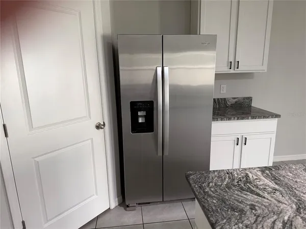 a white toilet sitting next to a white sink