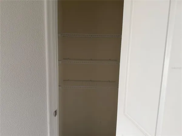 a bathroom with a shower sink and mirror