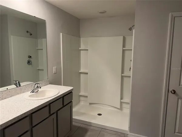 a view of an empty room with a window