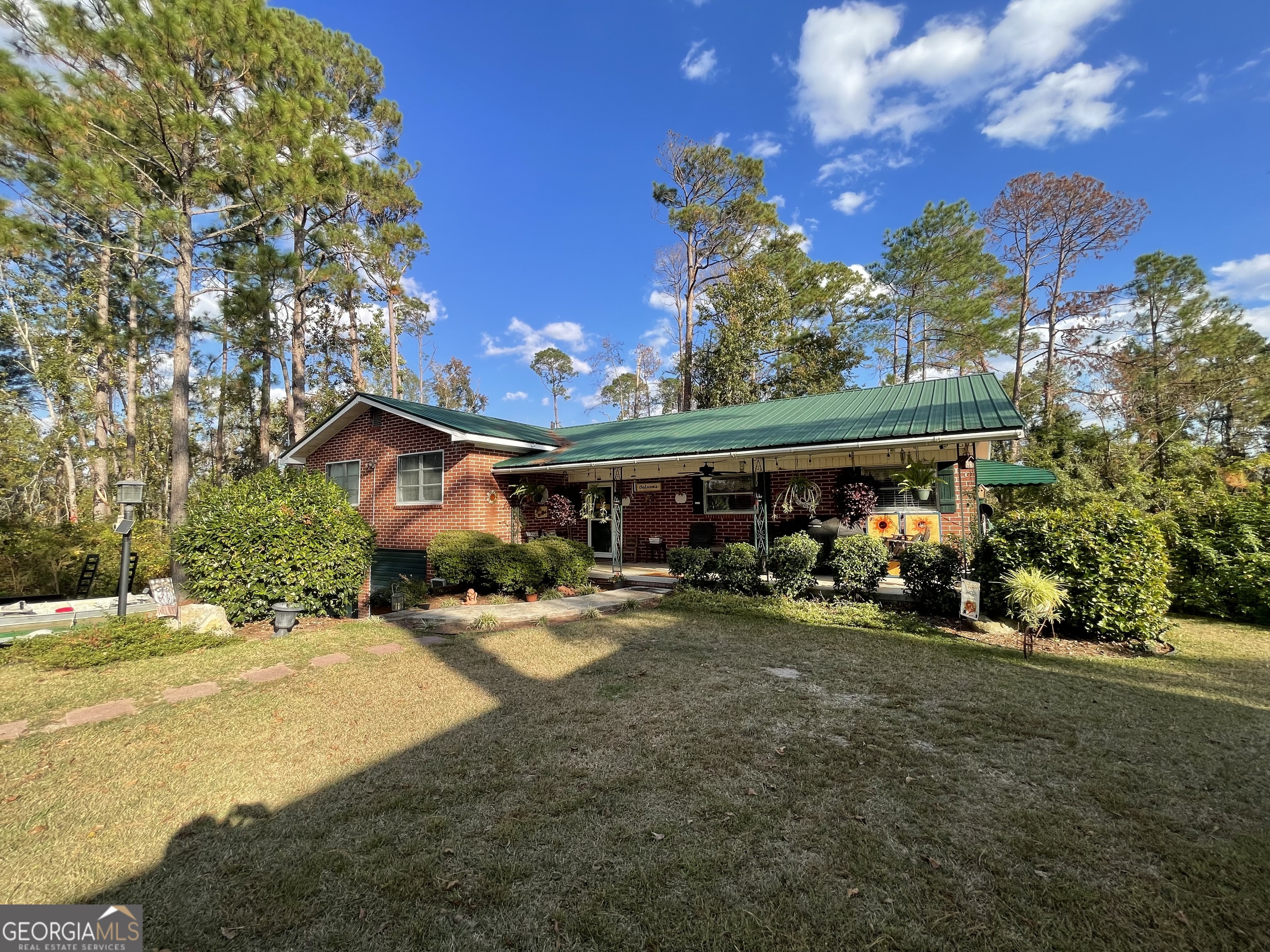 a view of a patio with table and chairs and potted plants