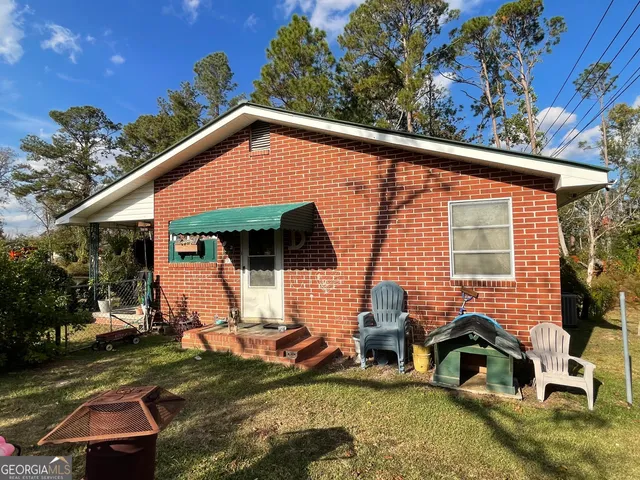 a backyard of a house with seating space