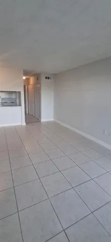 a view of a livingroom and entryway