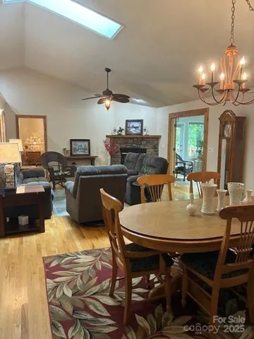 a large kitchen with granite countertop a stove and a sink