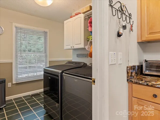 a bed room with a bed and a chair