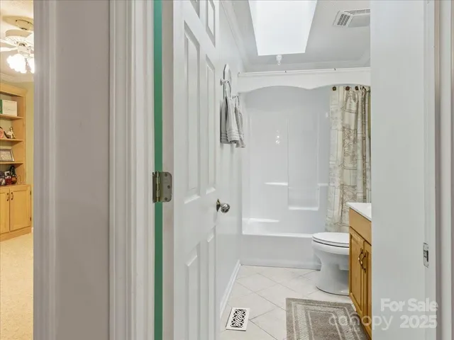 a view of a workspace with furniture and wooden floor