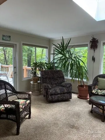 a couple of chairs sitting in a room next to a window