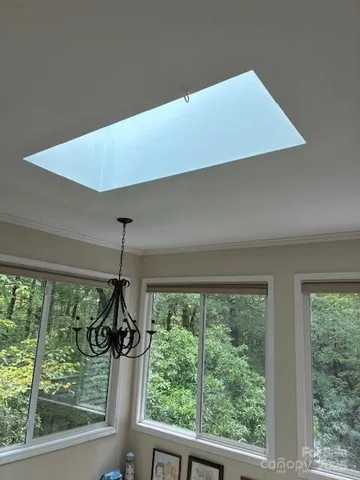 a living room with couches and a flat screen tv