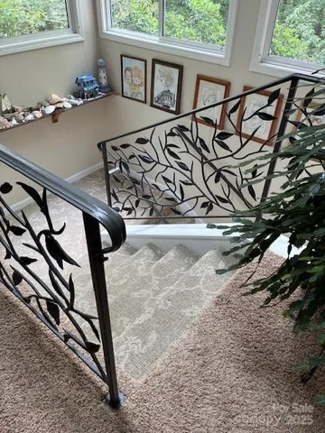 a large pool table and chairs in a room