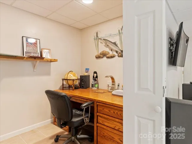 a balcony with wooden floor and outdoor seating