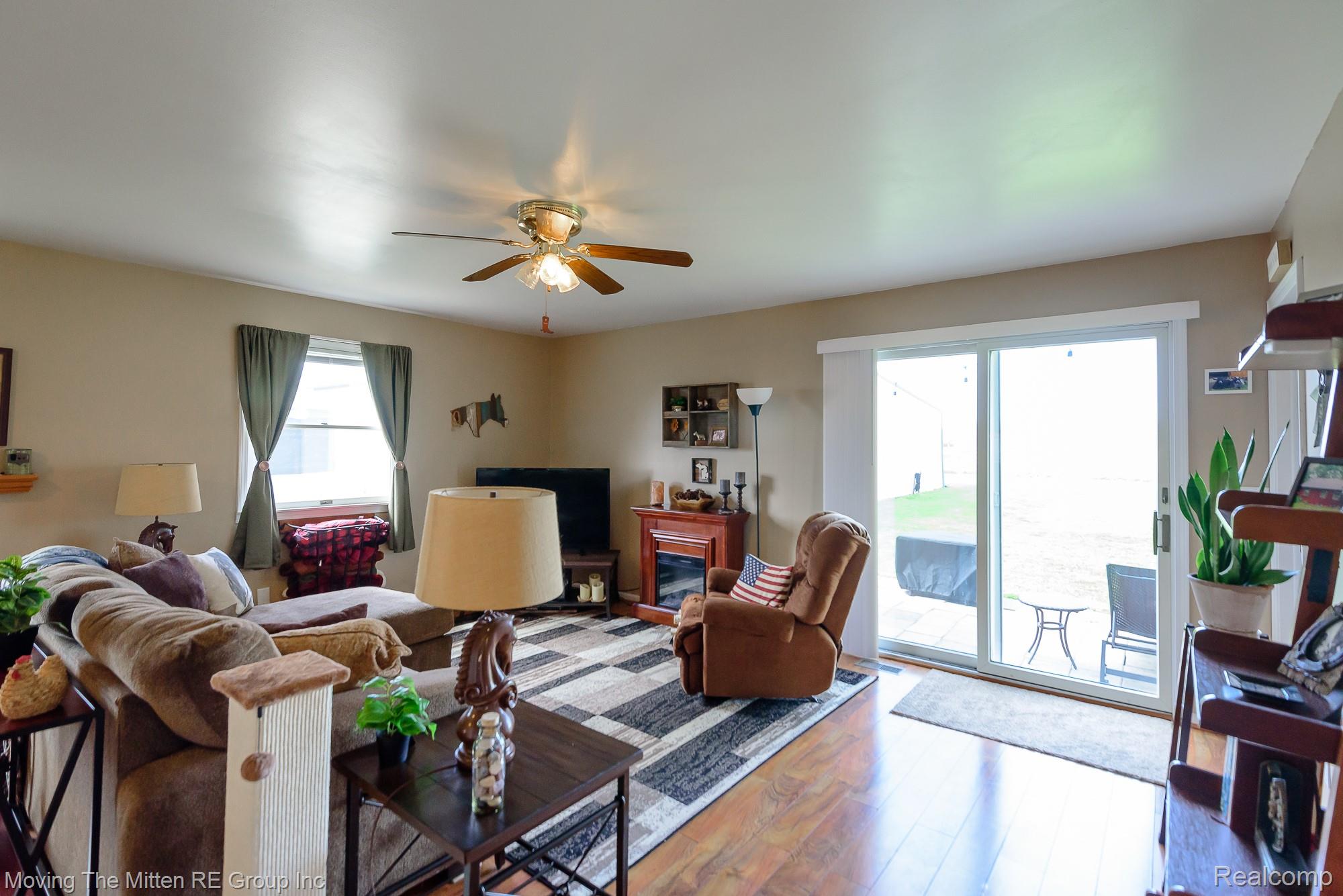 9260 Pitman Road Ypsilanti, MI 48197 - Photo 8 of 45 Living room with wood finished floors and a ceiling fan