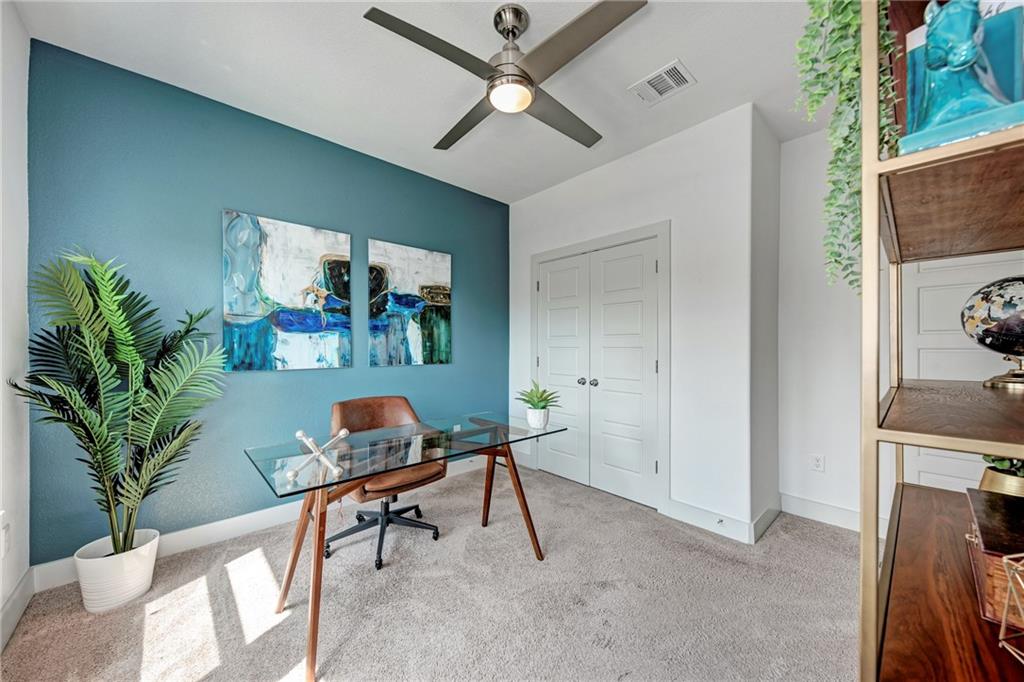 6006 Rubicon Run Austin, TX 78745 - Photo 18 of 22 a living room with furniture and a potted plant