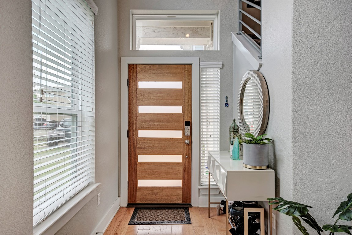 6006 Rubicon Run Austin, TX 78745 - Photo 5 of 22 a front view of a house with wooden floor and a dining table