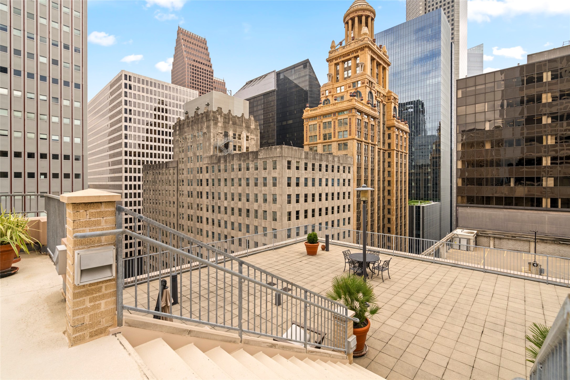 914 Main Street, Unit 1008 Houston, TX 77002 - Photo 23 of 26 Another rooftop lounge area with spectacular views of the city skyline, ideal for unwinding.