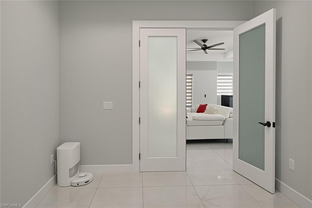 2330 4th Avenue Southeast Naples, FL 34117 - Photo 21 of 39 Ensuite bathroom featuring light tile patterned flooring and a ceiling fan
