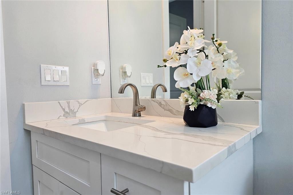 2330 4th Avenue Southeast Naples, FL 34117 - Photo 32 of 39 Bathroom with vanity